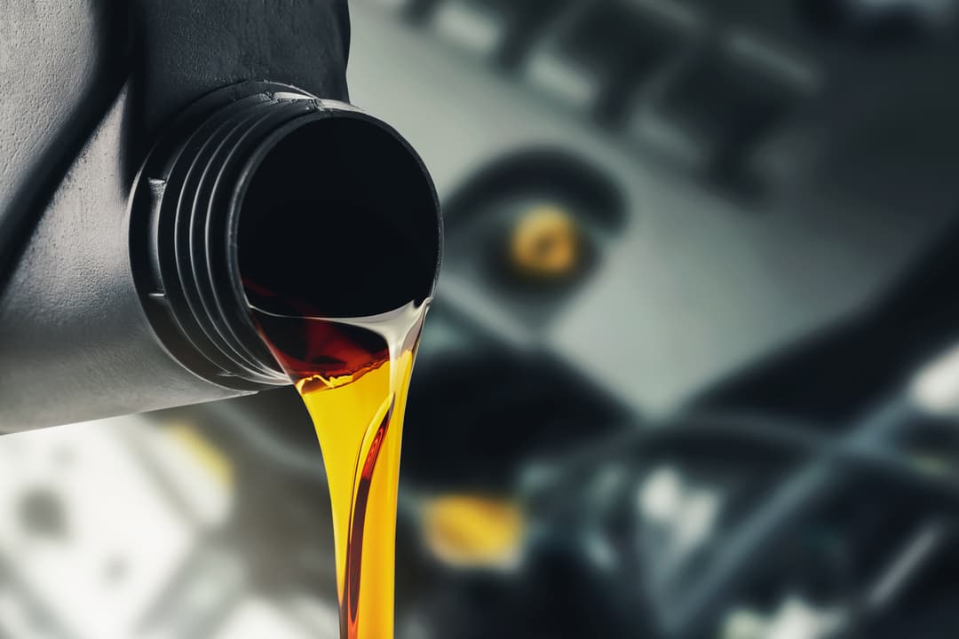 Pouring Oil Into Engine